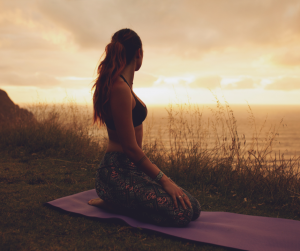 Woman yoga on the beach