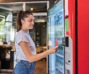 woman interacting with a vending machine