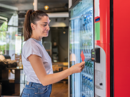 woman interacting with a vending machine